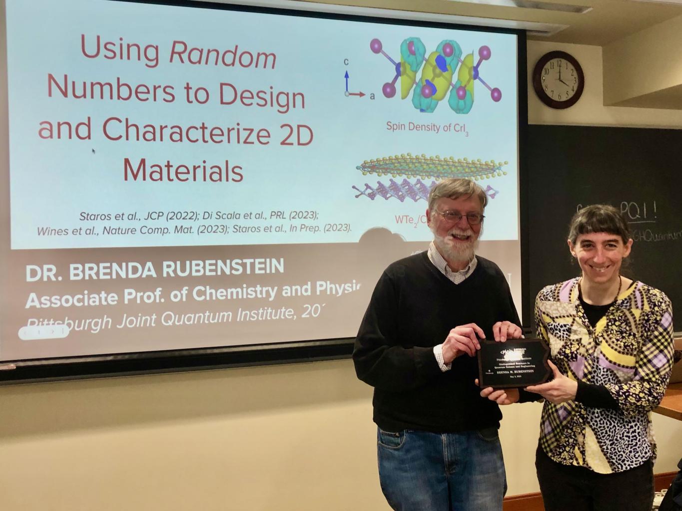 Professor Rubenstein receives her plaque from Professor Ken Jordan